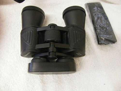 A PAIR OF MAGNALOUX GL3 BINOCULARS 10X50 FILED VIEW 7 DEGREES