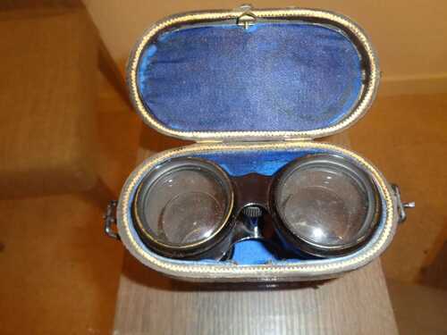 Antique field glasses in case