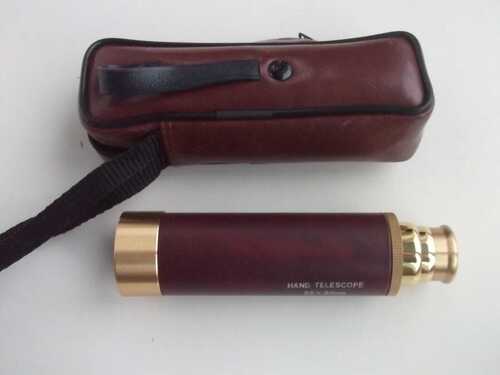 NEW. HAND HELD TELESCOPE AND CASE .